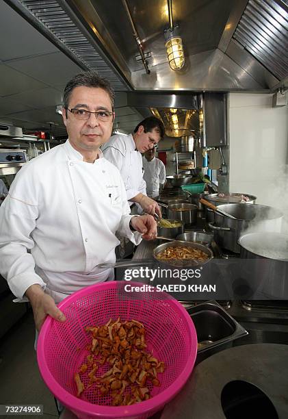 Michelin three star chef Jean-Michel Lorain from France along with mates prepares lunch at the Mezzaluna resturant in Bangkok, 08 February 2006....