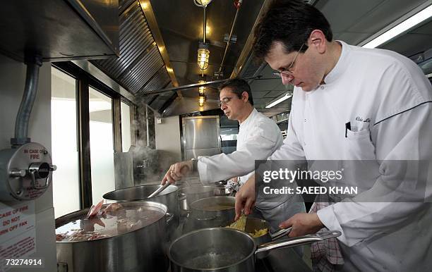 Michelin three star chef Jean-Michel Lorain from France along with a mate prepares lunch at the Mezzaluna resturant in Bangkok, 08 February 2006....