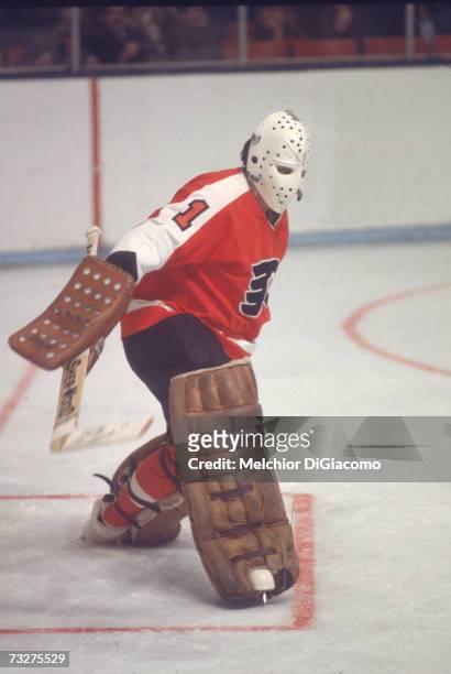 Canadian professional ice hockey player Bernie Parent, goalie of the Philadelphia Flyers, defends the goal during ana way game, late 1960s or 1970s....
