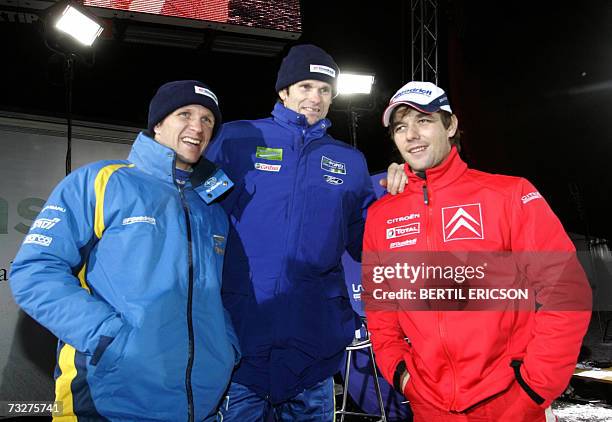 The three top drivers after the second day of Swedish Rally pose 09,February 2007 after the race. Marcus Gronholm of Finland is in the lead Sebastien...