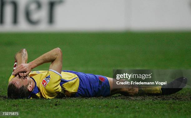 Dennis Brinkmann of Braunschweig is injured during the Second Bundesliga match between Eintracht Braunschweig and 1.FC Cologne at the stadium an der...