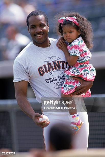 Barry Bonds of the San Francisco Giants with daughter, Shikari, during spring training circa 1994.