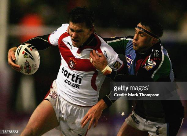 Matt Gidley of St Helens is tackled by Rob Purdham of Harlequins during the Engage Super League match between St Helens and Harlequins at the Mosley...