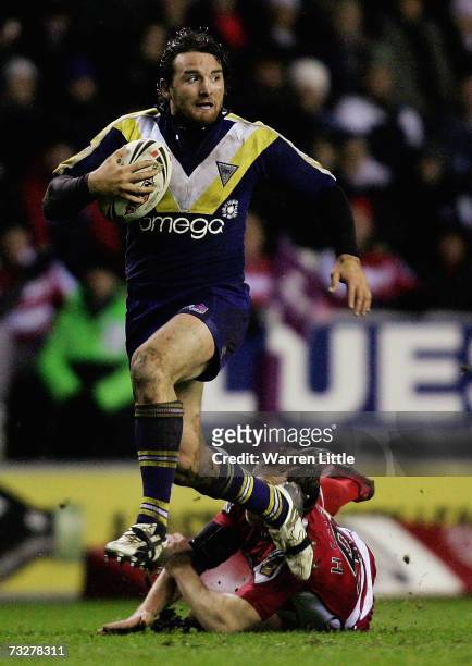 Martin Gleeson of Warrington Wolves evades a tackle during the Engage Super League match between Wigan Warriors and Warrington Wolves at the JJB...