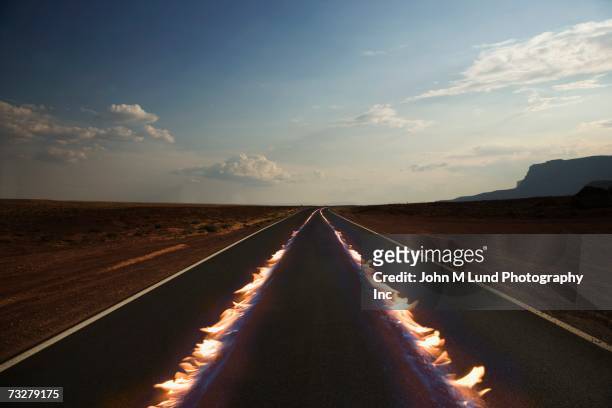 flaming tire marks on remote highway - burning stock pictures, royalty-free photos & images