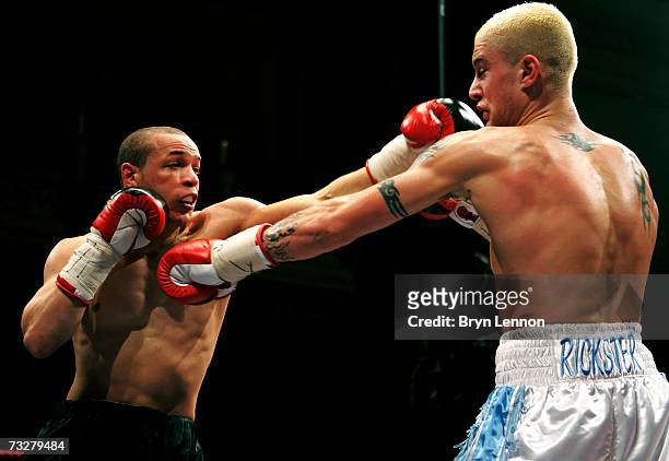 Carl Johanneson punches Ricky Burns during the British Super Featherweight title fight between Carl Johanneson and Ricky Burns at Leeds Town Hall on...