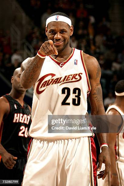 LeBron James of the Cleveland Cavaliers points to his son in the stands after dropping a jumper against the Miami Heat February 09, 2007 at The...