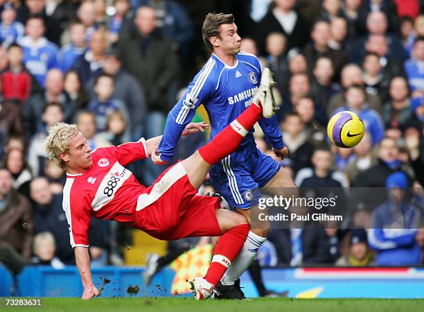 Andriy Shevchenko of Chelsea is tackled by Andrew Davies of Middlesbrough during the Barclays Premiership match between Chelsea and Middlesbrough at...