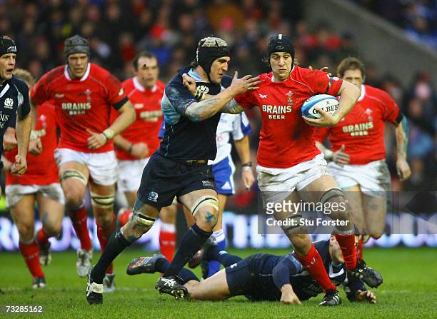 Ryan Jones of Wales holds off the challenge of Kelly Brown of Scotland during the RBS Six Nations match between Scotland and Wales at Murrayfield...