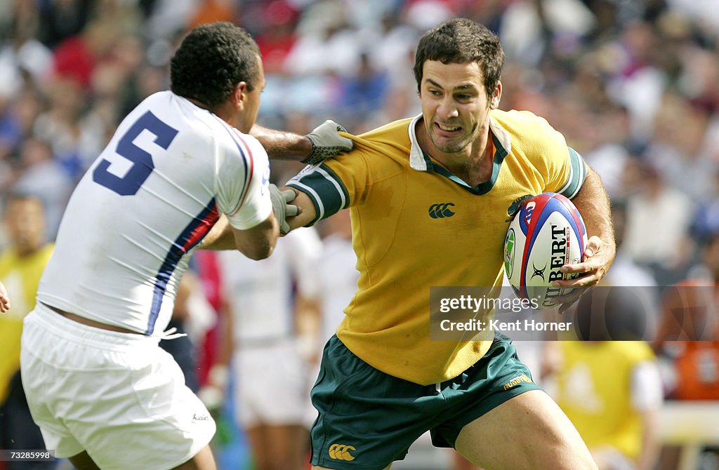 Tom Cooper Rugby Tom Couper of Australia runs the ball against Jone Naqica of the ...