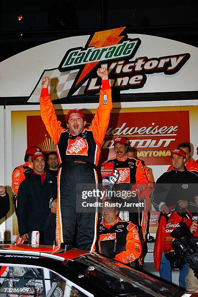 Tony Stewart, driver of the Home Depot Chevrolet, celebrates after winning the Budweiser Shootout at Daytona International Speedway on February 10,...