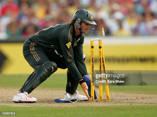 Adam Gilchrist of Australia waits as the ball strikes the stumps to run out Mal Loye of England during the Commonwealth Bank One Day International...
