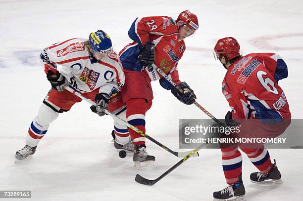 Tomas Netik of the Czech Republic playus against Russia's Maxim Kondratiev and Dimitri Vorobyev during the LG Hockey Games tournament, part of the...