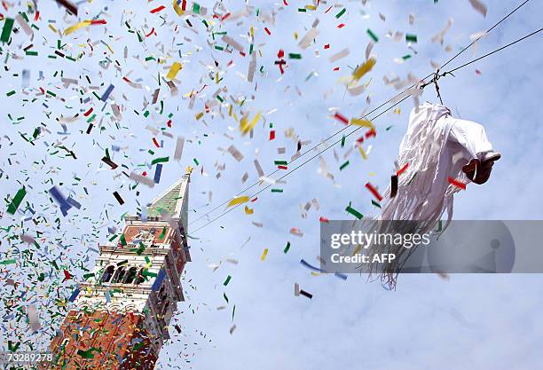 Italian swimmer Federica Pellegrini, silver medalist at the 2004 Athens Olympic games, performs as 'Colombina' flying from the San Marco Tower bell...