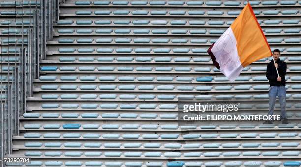 Roma fan stands on an empty tribune during the Italian Serie A football match Roma vs Parma at Rome's Olympic Stadium, 11 Febuary 2007. Football has...