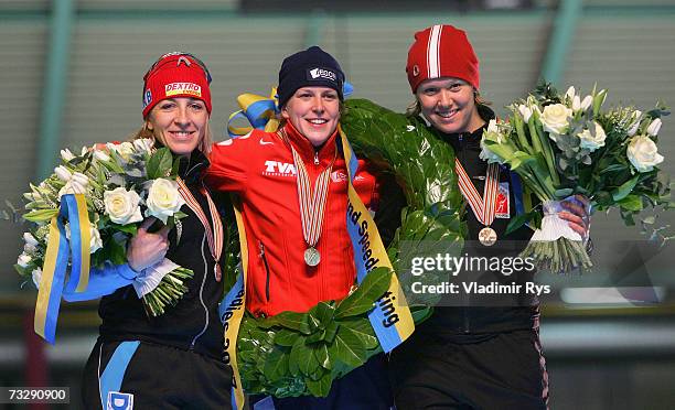 Anni Friesinger of Germany Ireen Wust of Netherlands and Cindy Klassen of Canada pose for a photo during the medal ceremony of the World Allround...