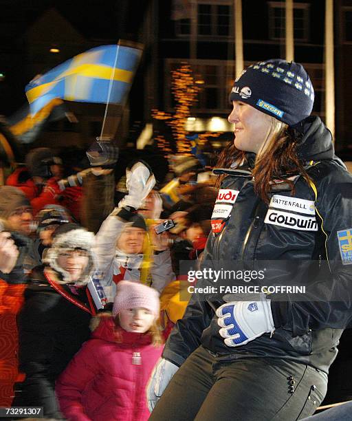 Swedish Anja Paerson is cheered by supporters as she arrives for the medal ceremony after the women's downhill, 11 February 2007, at the Alpine World...