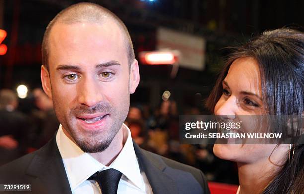 British actor Joseph Fiennes and his partner Natalie Jackson Mendoza pose on the red carpet as they arrive for the premiere of the movie "Goodbye...