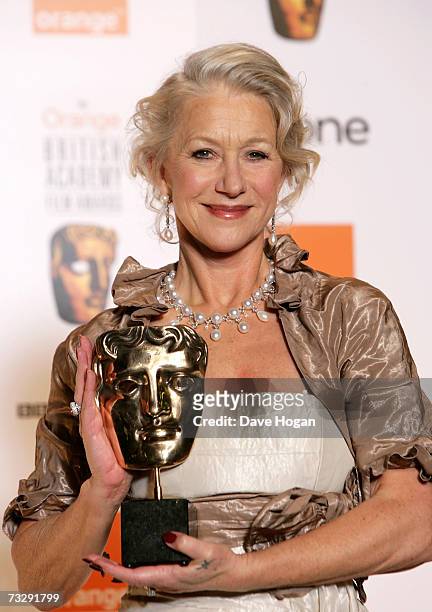 Actress Dame Helen Mirren poses with the award for Best Actress in a Leading Role for "The Queen" in the awards room at The Orange British Academy...