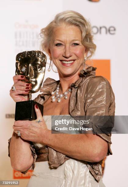 Actress Dame Helen Mirren poses with the award for Best Actress in a Leading Role for "The Queen" in the awards room at The Orange British Academy...