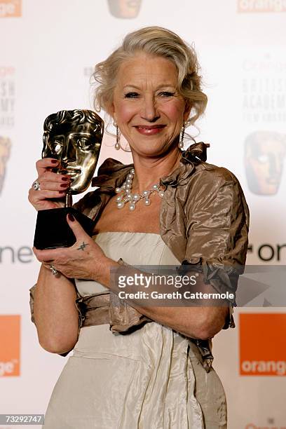 Actress Helen Mirren poses backstage in the Awards Room with The Actress in a Leading Role Award for 'The Queen' at The Orange British Academy Film...