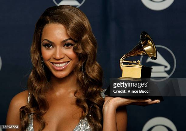 Singer Beyonce Knowles poses with her Grammy for Best Contemporary R&B Album for "B'Day" in the press room at the 49th Annual Grammy Awards at the...