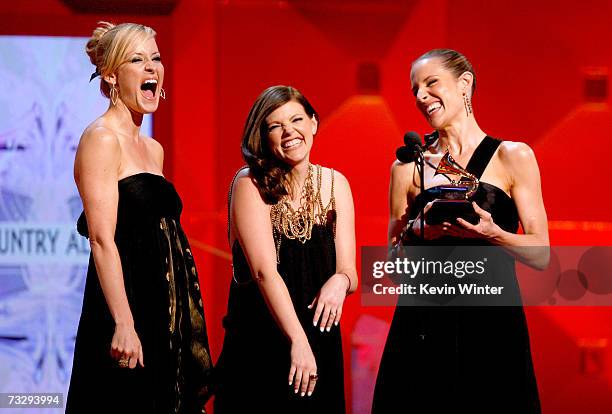 The Dixie Chicks Martie Maguire, Natalie Maines and Emily Robinson accept their award for "Best Country Album" for Taking the Long Way Home onstage...