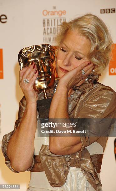Actress Helen Mirren poses with the Best Actress Award in the awards room at the Orange British Academy Film Awards, at the Royal Opera House on...