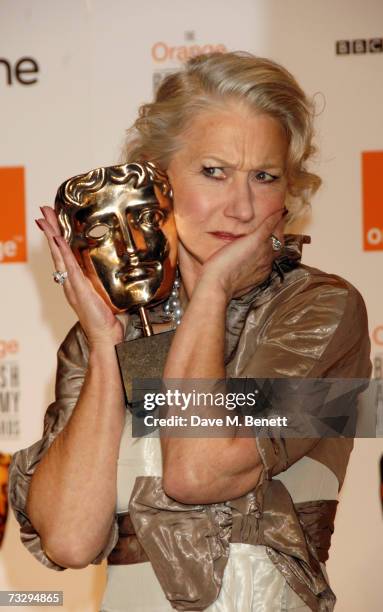 Actress Helen Mirren poses with the Best Actress Award in the awards room at the Orange British Academy Film Awards, at the Royal Opera House on...