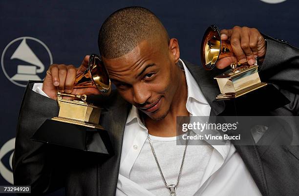 Rapper T.I. Poses with his Grammys for Best Rap Solo Performance for "What You Know" and Best Rap Song Collaboration for "My Love" in the press room...