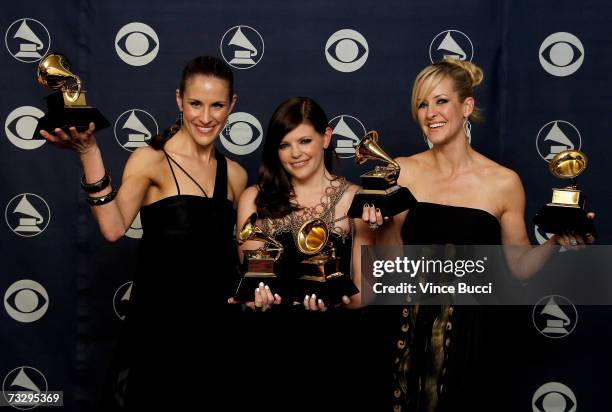 Musicians Emily Robinson, Natalie Maines and Martie Maguire of the group The Dixie Chicks poses with their Grammy's for Record of the Year, Album of...