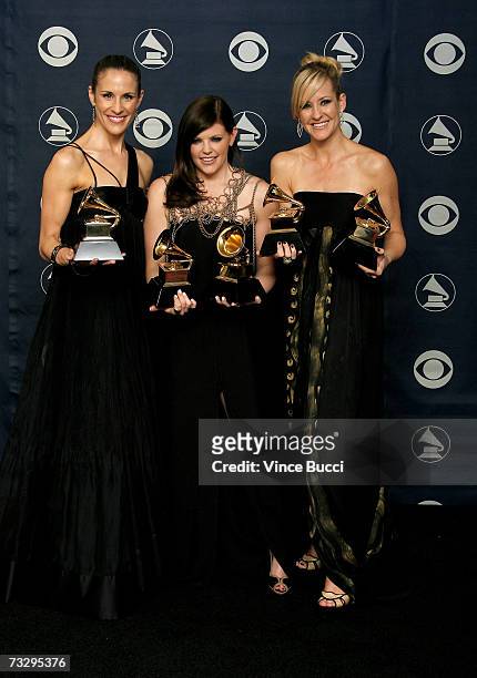 Musicians Emily Robinson, Natalie Maines and Martie Maguire of the group The Dixie Chicks poses with their Grammy's for Record of the Year, Album of...