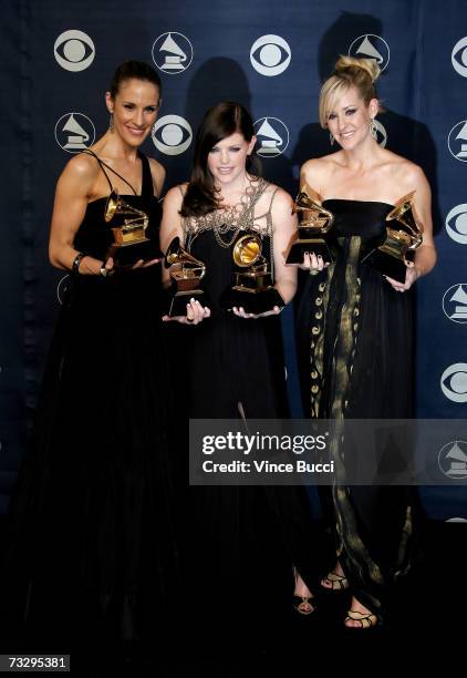 Musicians Emily Robinson, Natalie Maines and Martie Maguire of the group The Dixie Chicks poses with their Grammy's for Record of the Year, Album of...