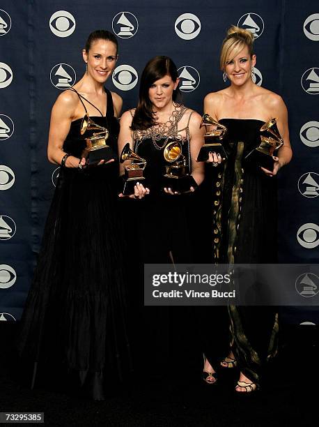 Musicians Emily Robinson, Natalie Maines and Martie Maguire of the group The Dixie Chicks poses with their Grammy's for Record of the Year, Album of...