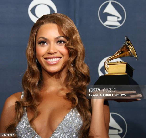 Los Angeles, UNITED STATES: Winner of Best Contemporary R&B Album Beyonce poses with her trophy at the 49th Grammy Awards in Los Angeles 11 February...