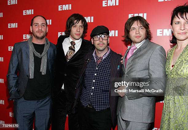 Musicians Dan Konopka, Damian Kulash, Tim Nordwind and Andy Ross of the band OK Go pose with music video choreographer Trish Sie as they arrive at...