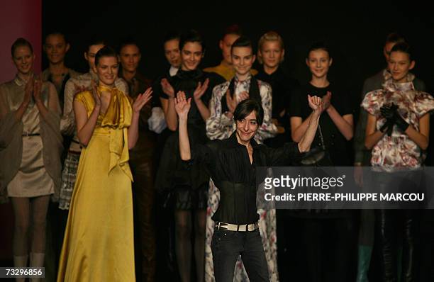Spanish designer Miriam Orcariz waves after presenting her Fall/Winter 2007 collection at Madrid fashion week, 12 February 2007. AFP...