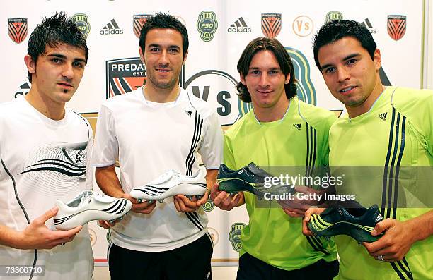 Group photo of David Villa, Hugo Viana, Lionel Messi and Javier Saviola presenting the new Adidas F-50 boots at the Adidas Barcelona store on...