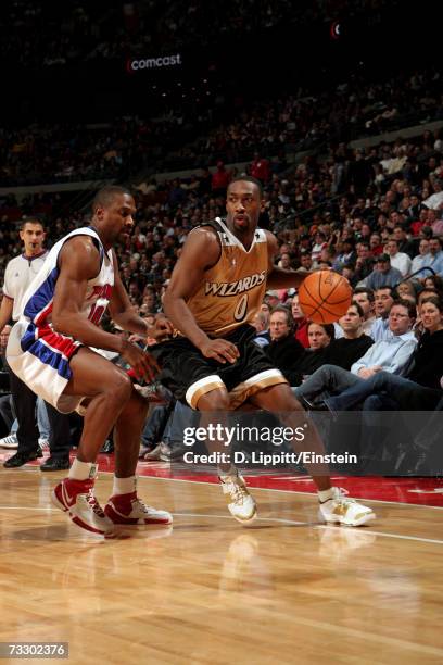 Gilbert Arenas of the Washington Wizards drives around Lindsey Hunter of the Detroit Pistons during the game at The Palace of Auburn Hills on January...