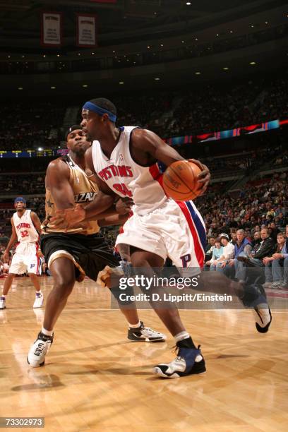 Chris Webber of the Detroit Pistons drives around Brendan Haywood of the Washington Wizards during the game at The Palace of Auburn Hills on January...