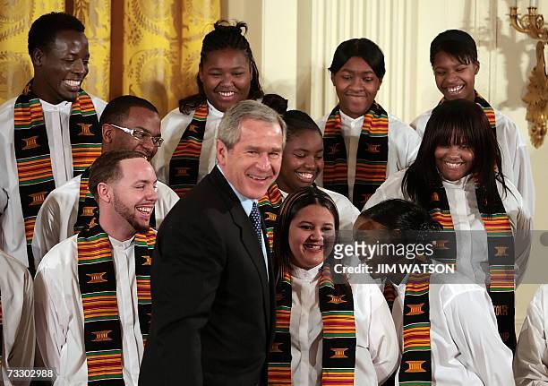 Washington, UNITED STATES: US President George W. Bush jokes with the Jackson, Michigan, High School Black History Tour Group at the Celebration of...