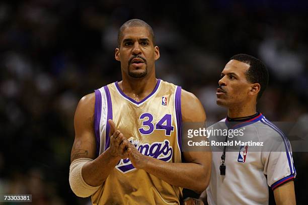 Official Eric Lewis talks with Corliss Williamson of the Sacramento Kings during a game against the Dallas Mavericks at the American Airlines Center...