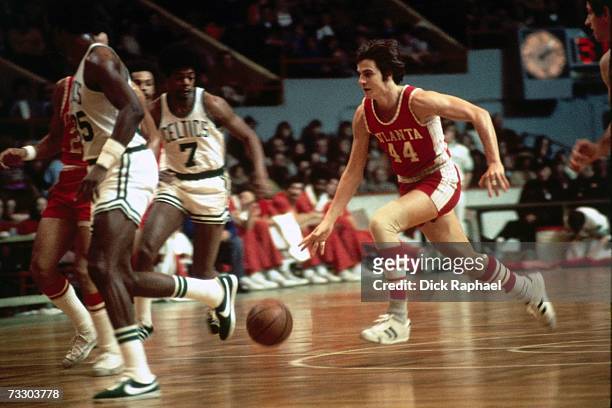Pete Maravich of the Atlanta Hawks drives to the basket against the Boston Celtics during the NBA game at the Boston Garden during the 1973-74 season...