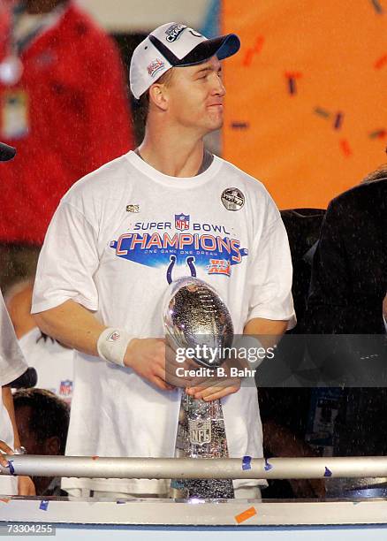 Quarterback Peyton Manning of the Indianapolis Colts holds the Vince Lombardi trophy as he is awarded MVP honors after Super Bowl XLI on February 4,...