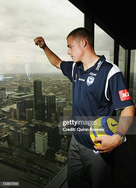 Melbourne Victory striker Danny Allsopp poses on the roof of the world's tallest residential tower, the Eureka Tower, and looks out towards the...
