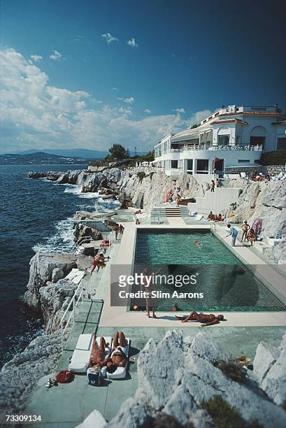 Guests round the swimming pool at the Hotel du Cap Eden-Roc, Antibes, France, August 1976.