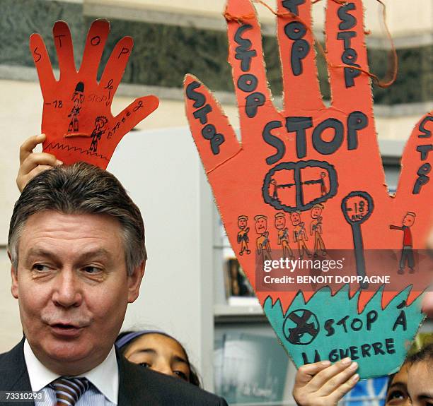Foreign Minister Karel De Gucht poses with children during a demonstration organized by the Belgian coalition against the use of child soldiers in...