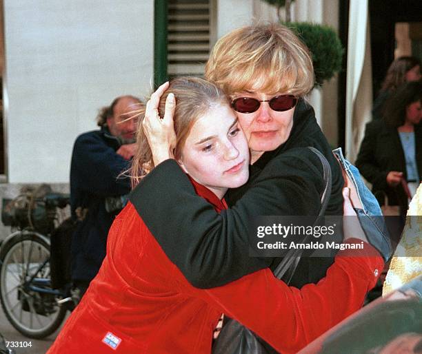 With an emotional hug, Jessica Lange says goodbye to her daughter Hannah Jane October 23, 2000 in front of a mid-town hotel before she left in a taxi...