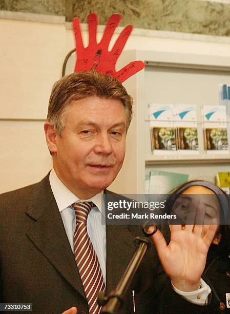 Belgian Minister of Foreign Affairs Karel De Gucht talks to 10-12 year old children who support operation Red Hand Day, at the Belgian Ministry of...