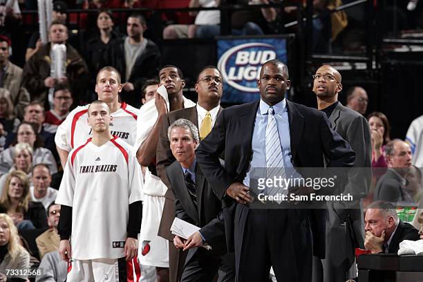 Head coach Nate McMillan of the Portland Trail Blazers stands with assistant coaches Dean Demopoulos, Maurice Lucas and Monty Williams during the NBA...